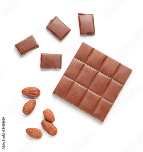 Tasty chocolate and almond nuts on white background