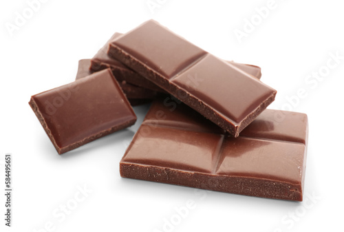 Pieces of tasty chocolate bar on white background