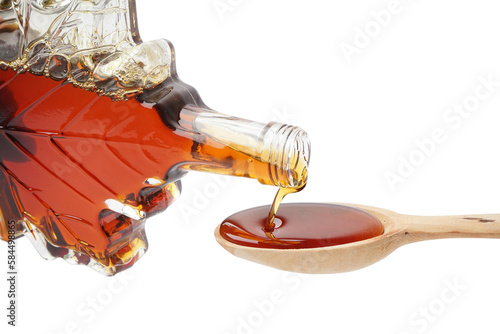 Pouring of tasty maple syru...