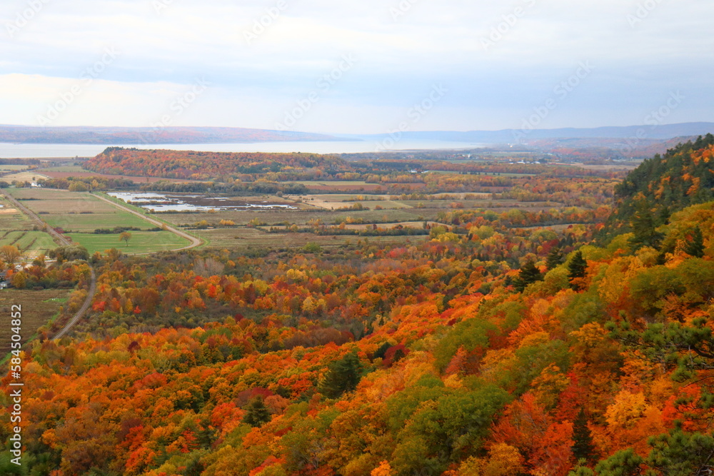 Viewpoint in Cap-Tourment in Quebec and Canada. Autumn landscape and trees. Fall and leaves. Hiking and trail in autumn. Quebec tourism in Canada. September and october background. Hiking and trail.