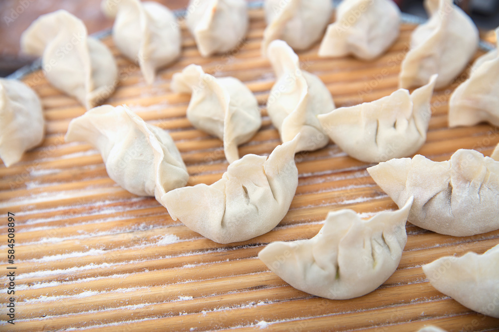 Wrapped uncooked white flour dumplings Wrapped uncooked white flour dumplings