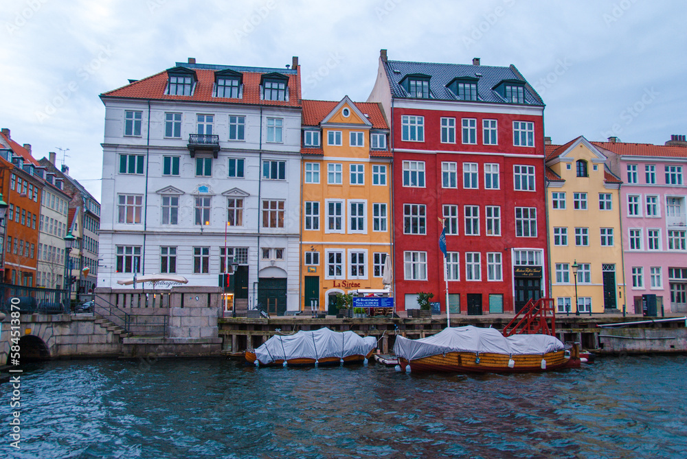 Colorful houses along the canal in Nyhavn harbor in the historical city center of Copenhagen, Denmark