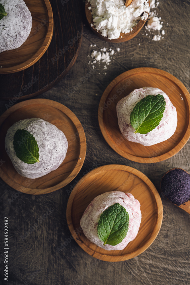 Japanese mochi or rice cake filled with red bean and strawberry, mint leaves on top. Japan traditional rice cake. Japanese mochi or rice cake filled with red bean and strawberry, mint leaves on top. Japan traditional rice cake.