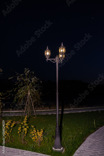 Beautiful well-maintained modern park in the city of Kuvshinovo, Tver region at night. photo