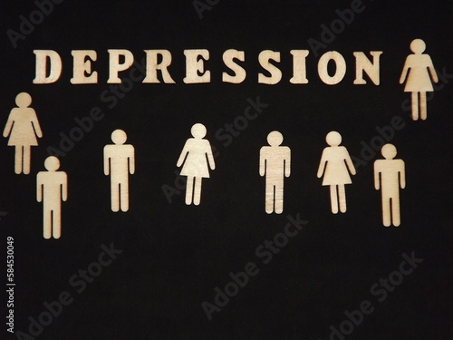 mental illness depression in wooden letters on a black background