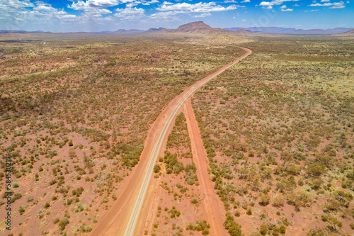 Looking down at intersecting dirt tracks at the red terrain earth in outback Australia