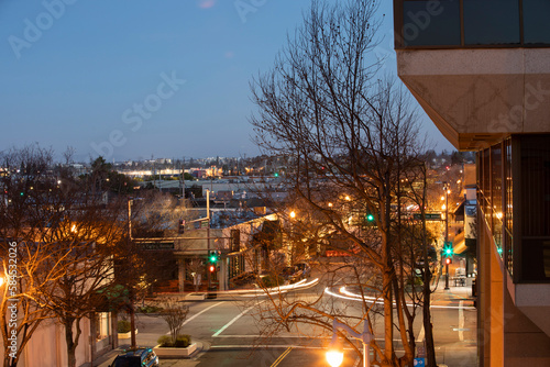 Night time view of traffic streaming through downtown San Carlos, California. photo