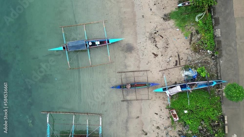 Aerial top view of outrigger bangka boats in Bato town, Catanduanes island, Philippines photo