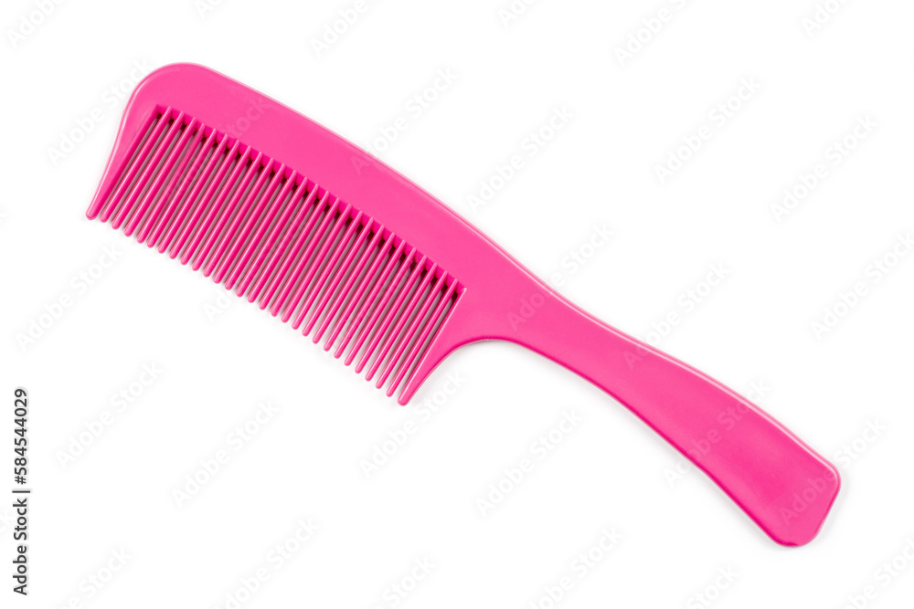 Pink comb with a handle on a white background. Simple plastic comb. Pink comb with a handle on a white background. Simple plastic comb.