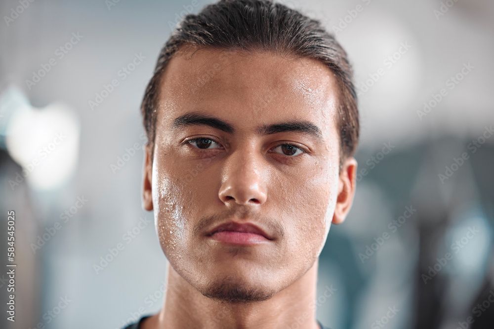 Portrait, sweat and intensity with a sports man closeup in the gym for a cardio or endurance workout. Fitness, face and focus with a male athlete taking a break after health training for wellness Portrait, sweat and intensity with a sports man closeup in the gym for a cardio or endurance workout. Fitness, face and focus with a male athlete taking a break after health training for wellness