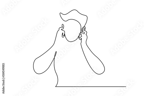 man covering his ears, plugging them in, he doesn't want to hear