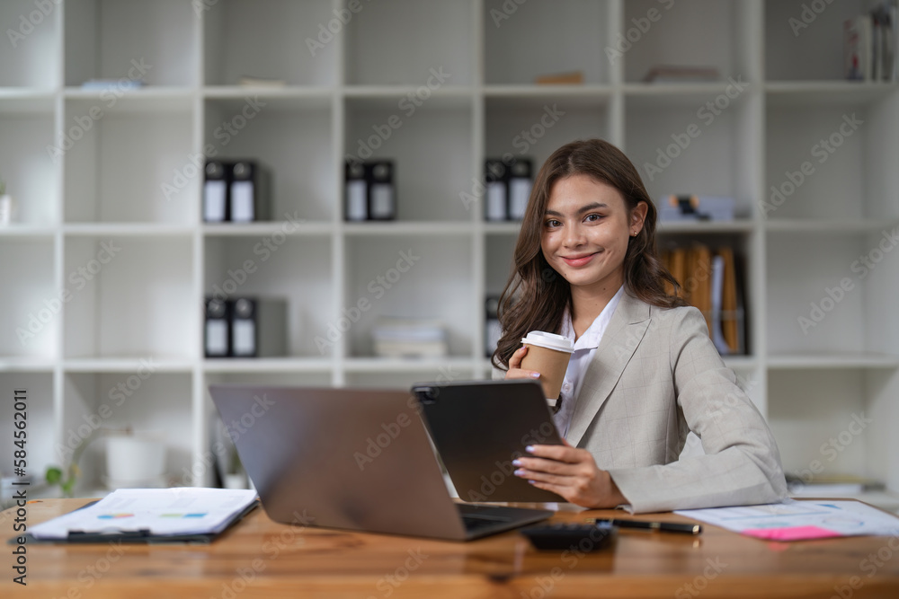 Portrait asian woman working with laptop in her office. business financial concept. Portrait asian woman working with laptop in her office. business financial concept.
