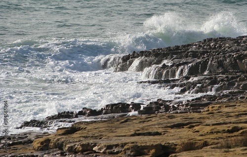 Waves at the rocky coastline in Luz, Lagos, Algarve - Portugal 