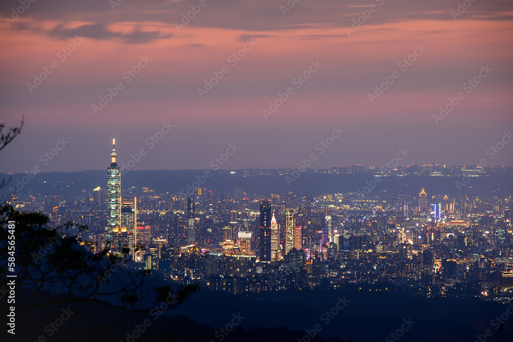 Dynamic Clouds and Urban Scenery: A image of Taipei's Evening Sky Mesmerizing Taipei Twilight: Orange Skies and Illuminated Cityscape
