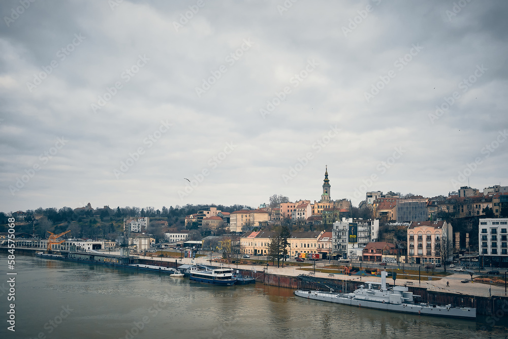 Panoramic view of Sava river embankment with moored ships and vessels and Saint Michael's Cathedral, Belgrade, Serbia
