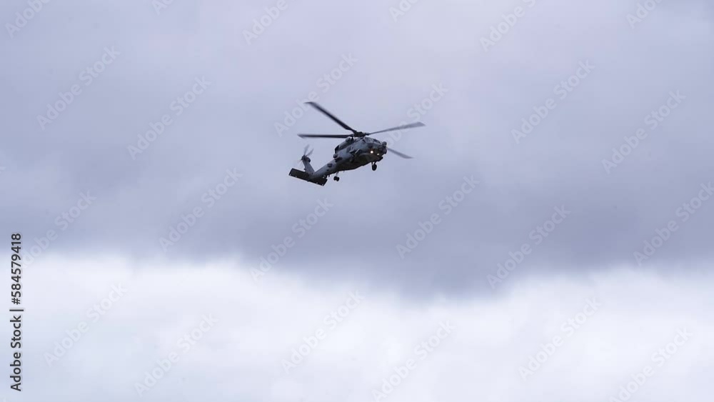 MH-60R Seahawk Helicopter Against Overcast Sky - low angle MH-60R Seahawk Helicopter Against Overcast Sky - low angle