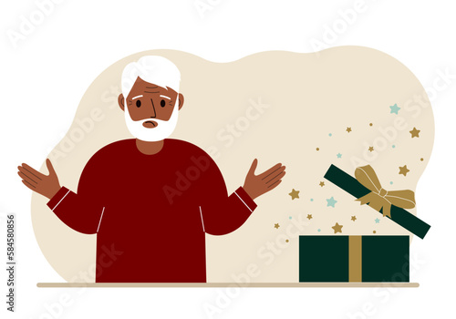 A grandfather next to an open gift. The concept of a holiday, surprise, promotion, discount.