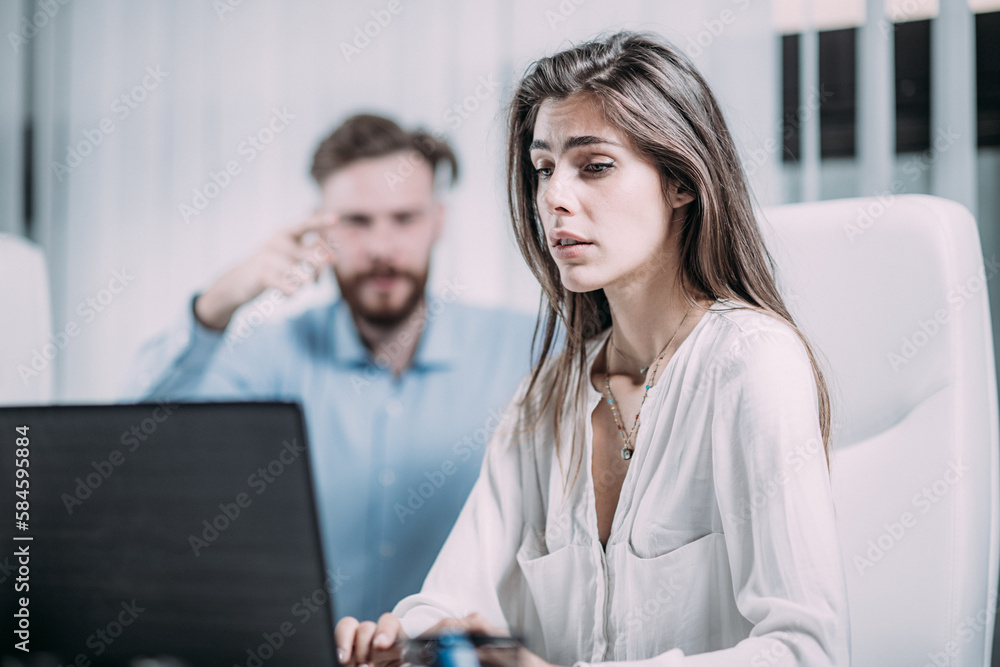 Mobbing at Work. Scared Female Employee in the Modern Office Mobbing at Work. Scared Female Employee in the Modern Office