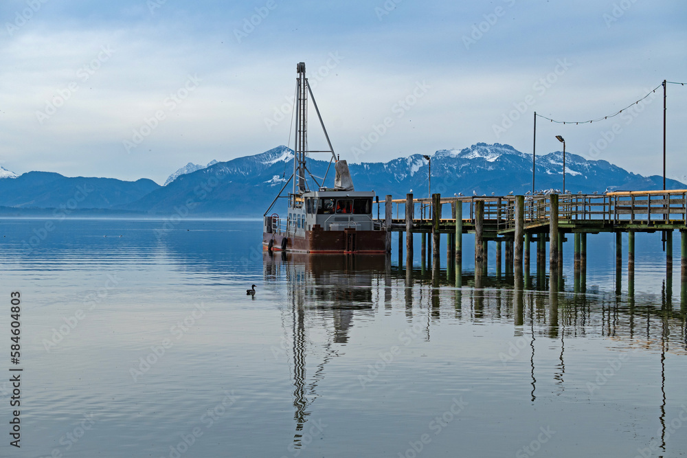 view over Chiemsee lake with the alps at the horizon view over Chiemsee lake with the alps at the horizon