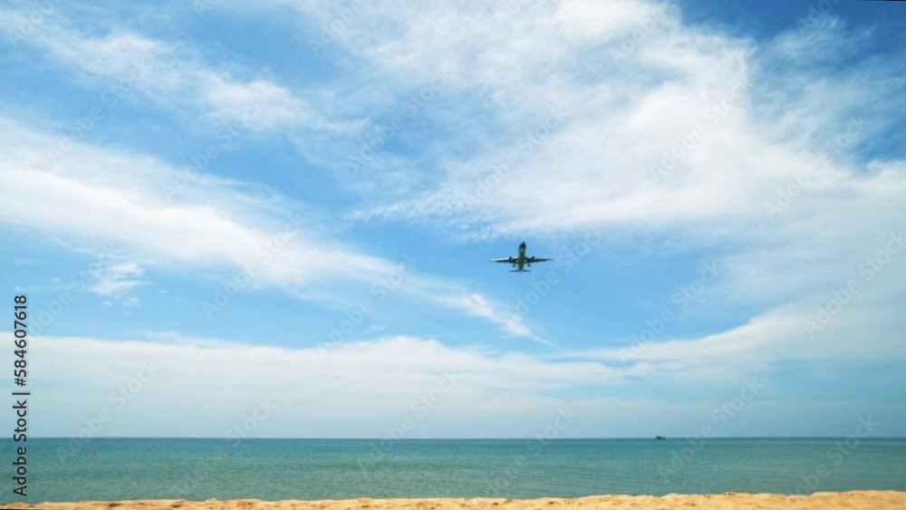 Passenger Aircraft in the Blue Sky. Airplane landing Over the Sea on a Sunny Day Concept of Travel and Business Passenger Aircraft in the Blue Sky. Airplane landing Over the Sea on a Sunny Day Concept of Travel and Business