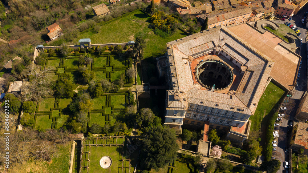 Aerial view of Villa Farnese and its gardens located in Caprarola, near Viterbo, Italy. It is a pentagonal palace in the Renaissance and Mannerist style. The building is empty.
