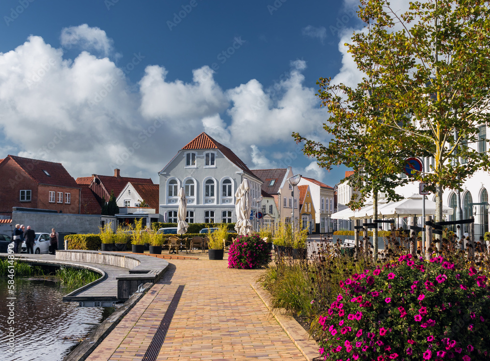Cityscape of Tønder, Southern Denmark (Syddanmark). Lake near the old town with flowers around it.