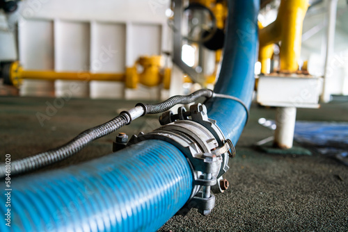 The pressure chemical hose is fitted with a coupling to prevent fraying of the blue rubber hose.