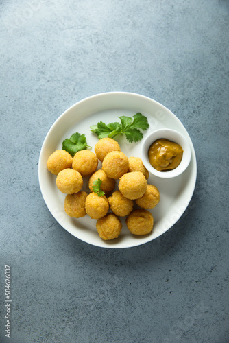 Homemade salmon croquettes with mustard