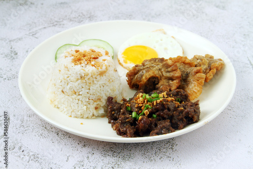 Filipino food called with beef tapa, chicharon bulaklak, fried rice and egg