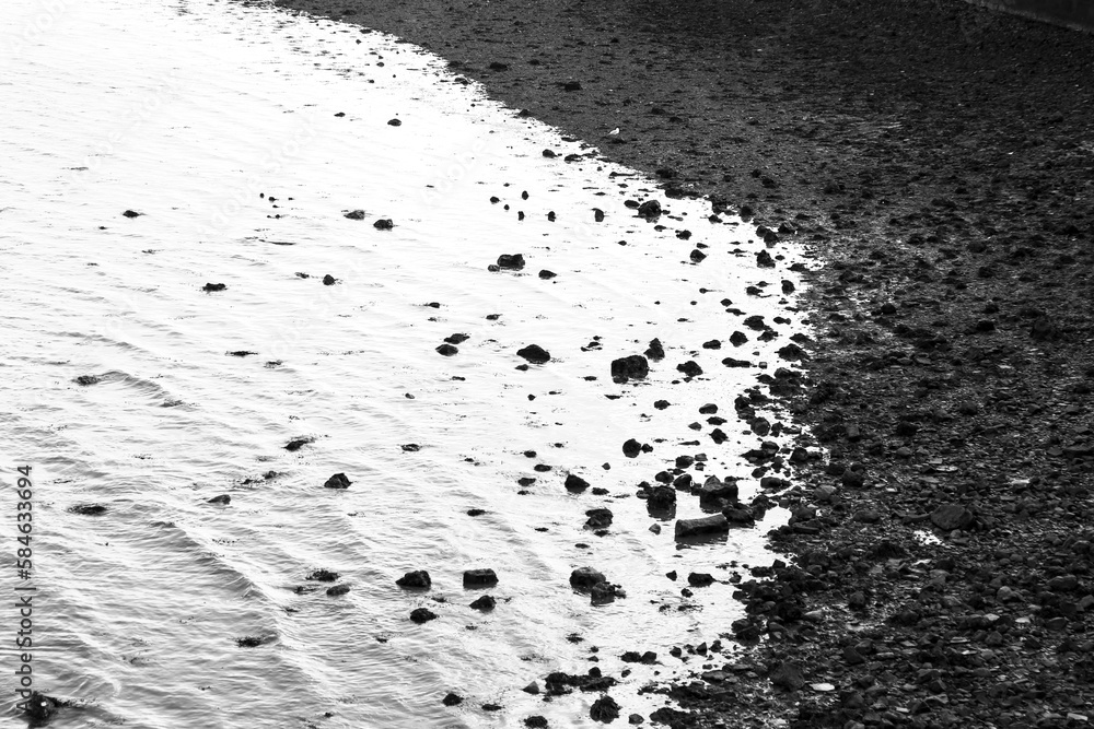 Rock textures and waves on the shore of the Tagus River Rock textures and waves on the shore of the Tagus River