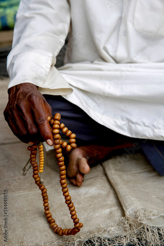 African muslim holding prayer beads in Abidjan, Ivory Coast.