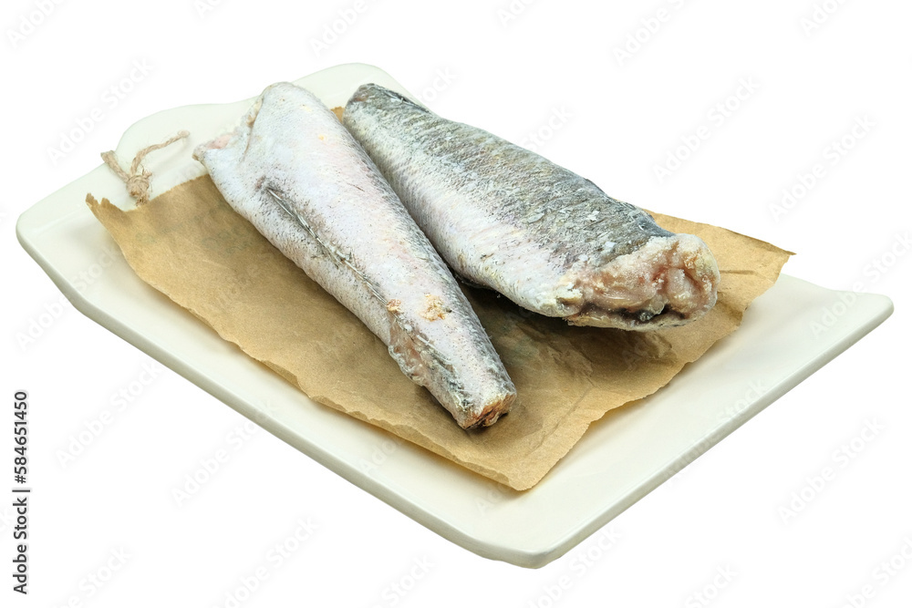 Uncooked frozen hake. Hake hubbsi without the heads and tails on a board isolated on white background. Uncooked frozen hake. Hake hubbsi without the heads and tails on a board isolated on white background.