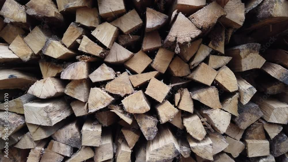 Firewood is stacked for drying. Wood for the winter Firewood is stacked for drying. Wood for the winter