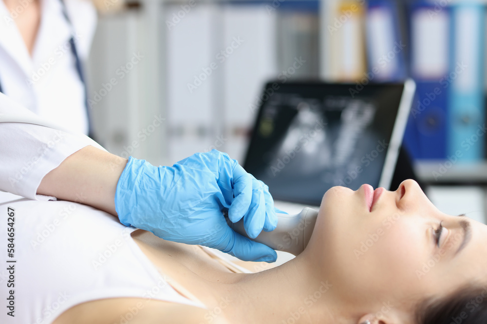 Ultrasound of the soft tissues of face of woman in medical office