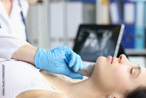 Obraz na płótnie Ultrasound of the soft tissues of face of woman in medical office w salonie