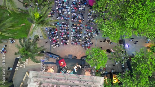 people are sitting and watching the program at  Dadar chow patty beach bird eye closeup to wide  view mumbai photo