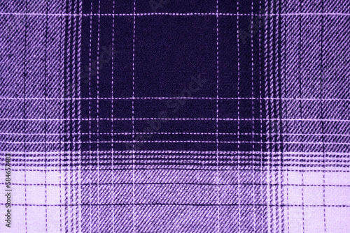 A purple tartan fabric with a purple stripe.
