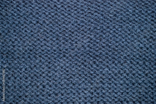 A blue knitted sweater with a pattern of the woven pattern.