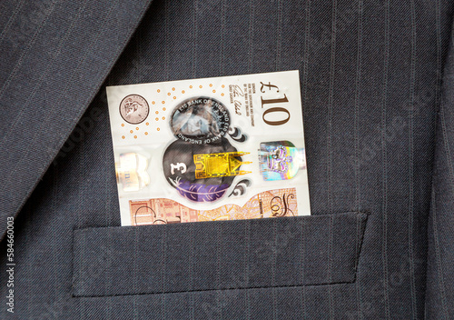 Bank of England 10 pounds note sticking out of pocket