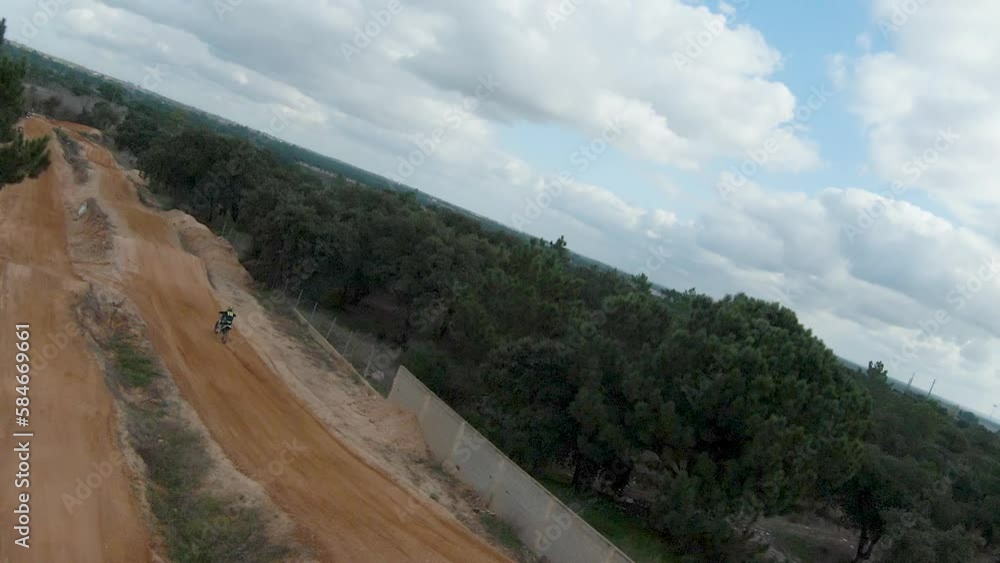 Quick aerial pan catches adrenaline junkie jumping getting epic air Quick aerial pan catches adrenaline junkie jumping getting epic air