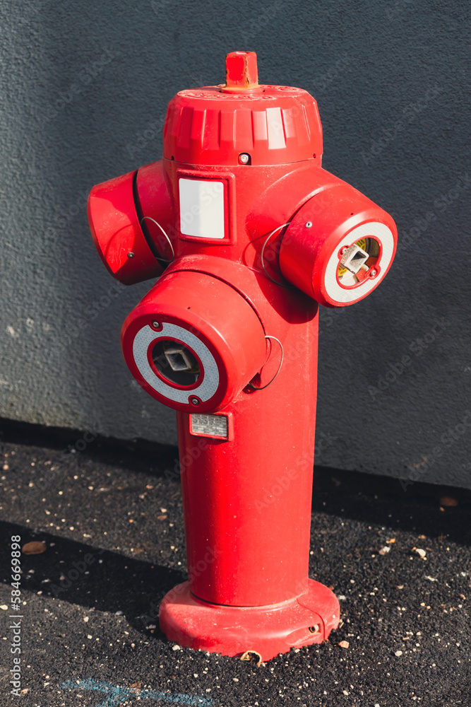 Fire hydrant in a french street in an emergency for firefighter intervention Fire hydrant in a french street in an emergency for firefighter intervention