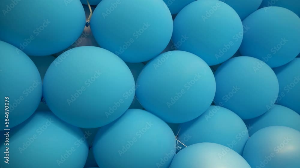 Panning view of the background of blue stacked balloons. Panning view of the background of blue stacked balloons.