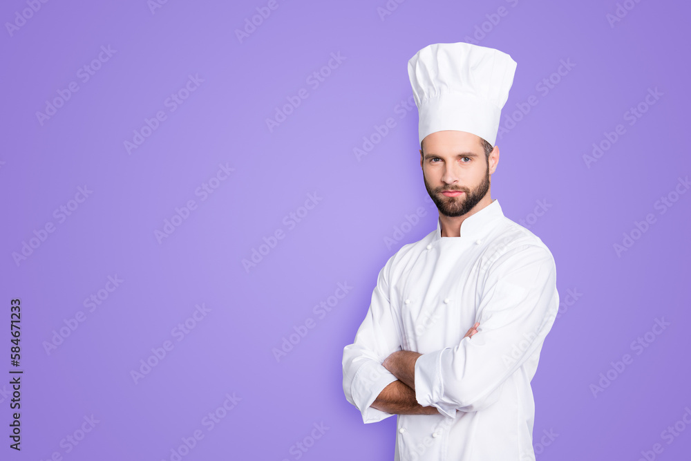 Portrait with copy space, empty place for advertisement, product of harsh virile chef cook with stubble in beret, white outfit having his arms crossed, isolated on grey background Portrait with copy space, empty place for advertisement, product of harsh virile chef cook with stubble in beret, white outfit having his arms crossed, isolated on grey background
