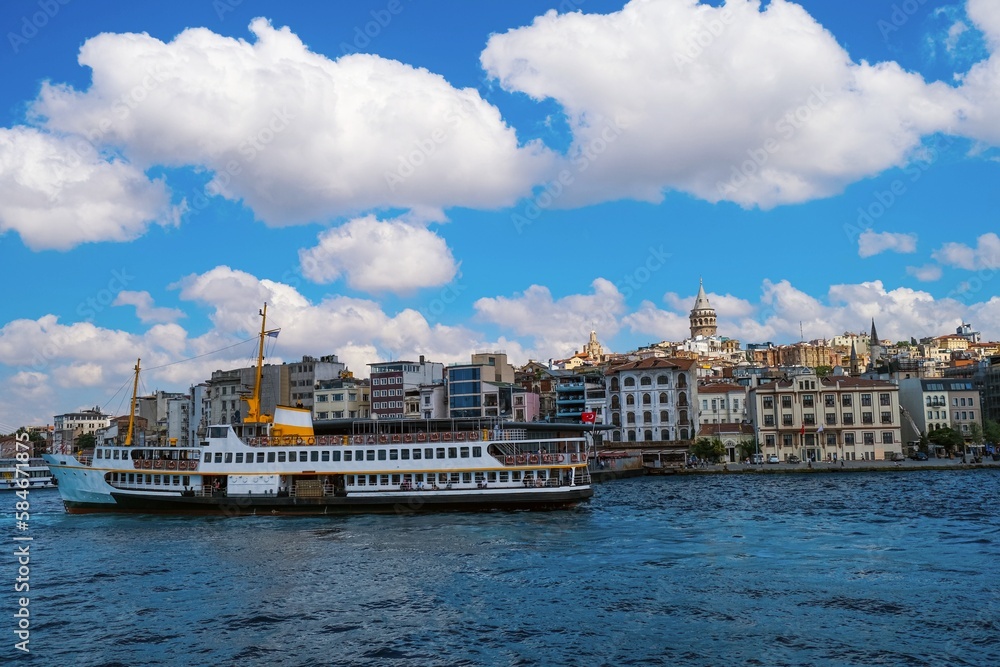 a distant view of the Galata tower and the ferry a distant view of the Galata tower and the ferry
