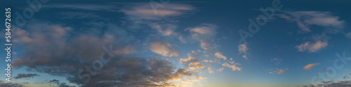 Fototapeta Naklejka Na Ścianę i Meble -  Panorama of a dark blue sunset sky with golden Cumulus clouds. Seamless hdr 360 panorama in spherical equiangular format. Full zenith for 3D visualization, sky replacement for aerial drone panoramas.
