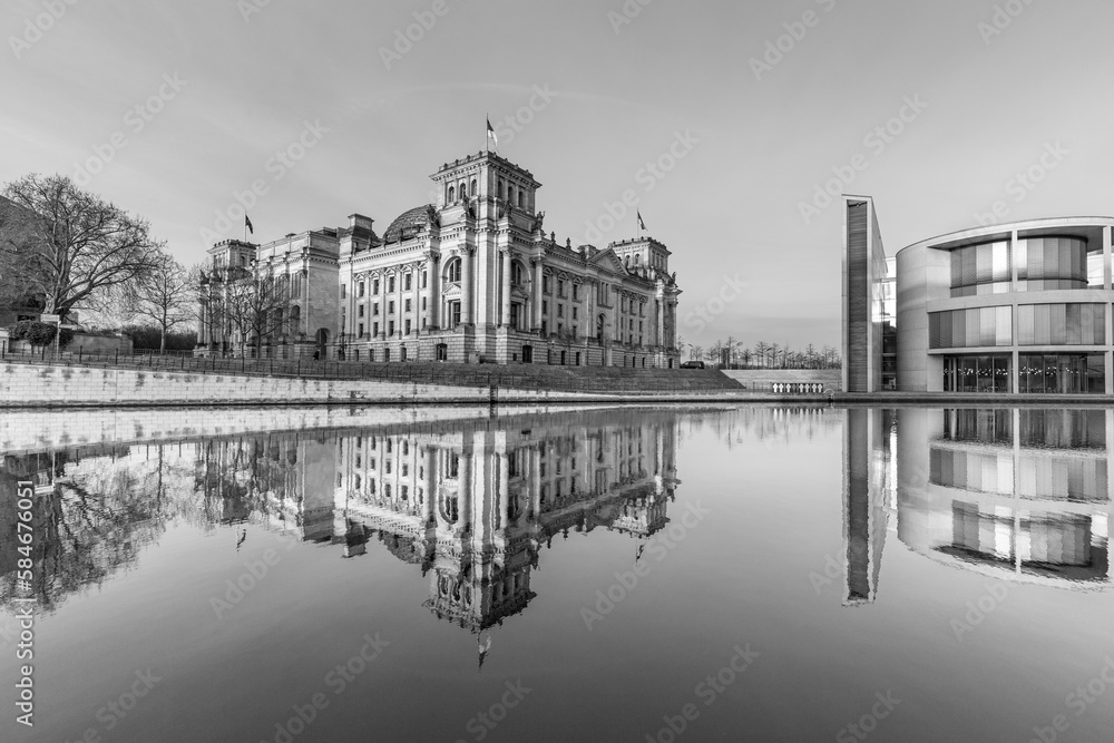Reichstag with reflection in river Spree