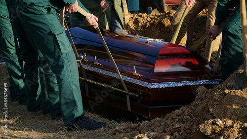 Funeral ceremony. People come to say goodbye. Burial in the grave.