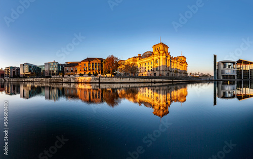 Reichstag with reflection in Spree, Berlin