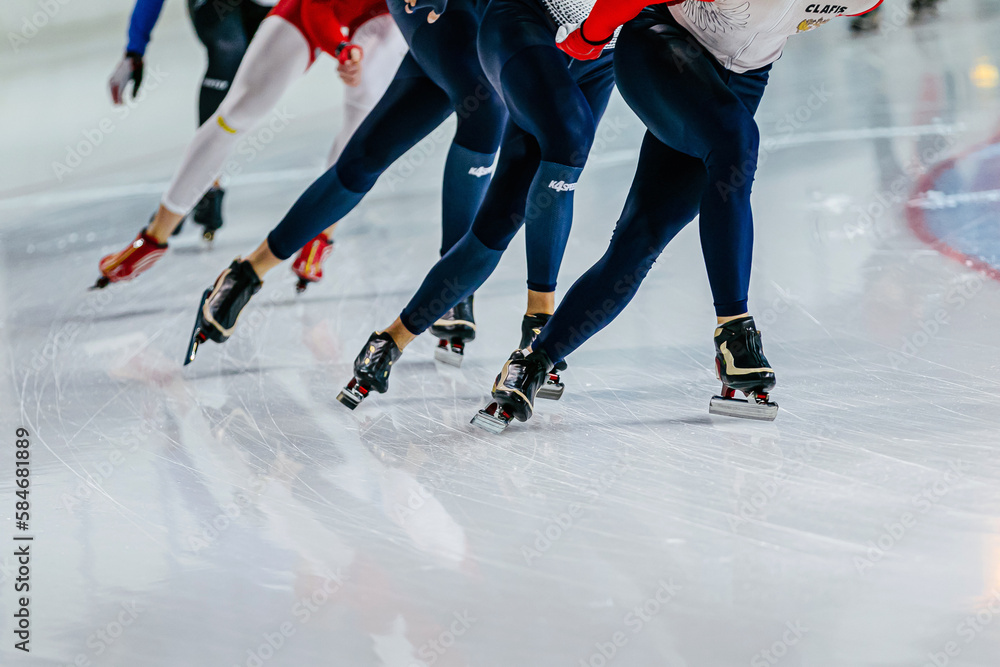 group speed skaters athletes at speed skating competition, skin suit