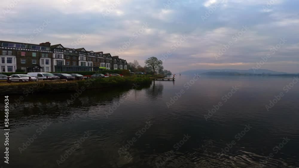 View of the Cumbrian village of Ambleside shot from the lake cruise ship on Lake Windermere. UK View of the Cumbrian village of Ambleside shot from the lake cruise ship on Lake Windermere. UK